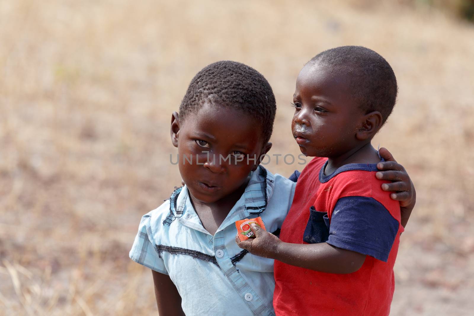 NAMIBIA, KAVANGO, OCTOBER 15: An unidentified dirty and poor Namibiann childrens near town Rundu in Kavango region, with the highest poverty level in Namibia. October 15, 2014, Namibia