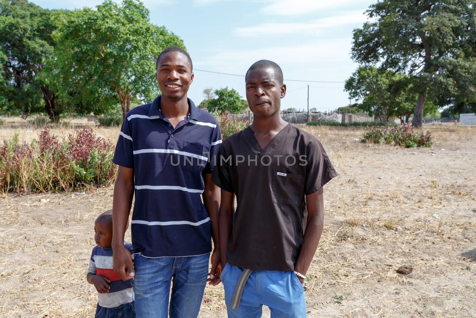 NAMIBIA, KAVANGO, OCTOBER 15: An unidentified namibian boys with small child near town Rundu in Kavango region, with the highest poverty level in Namibia. October 15, 2014, Namibia