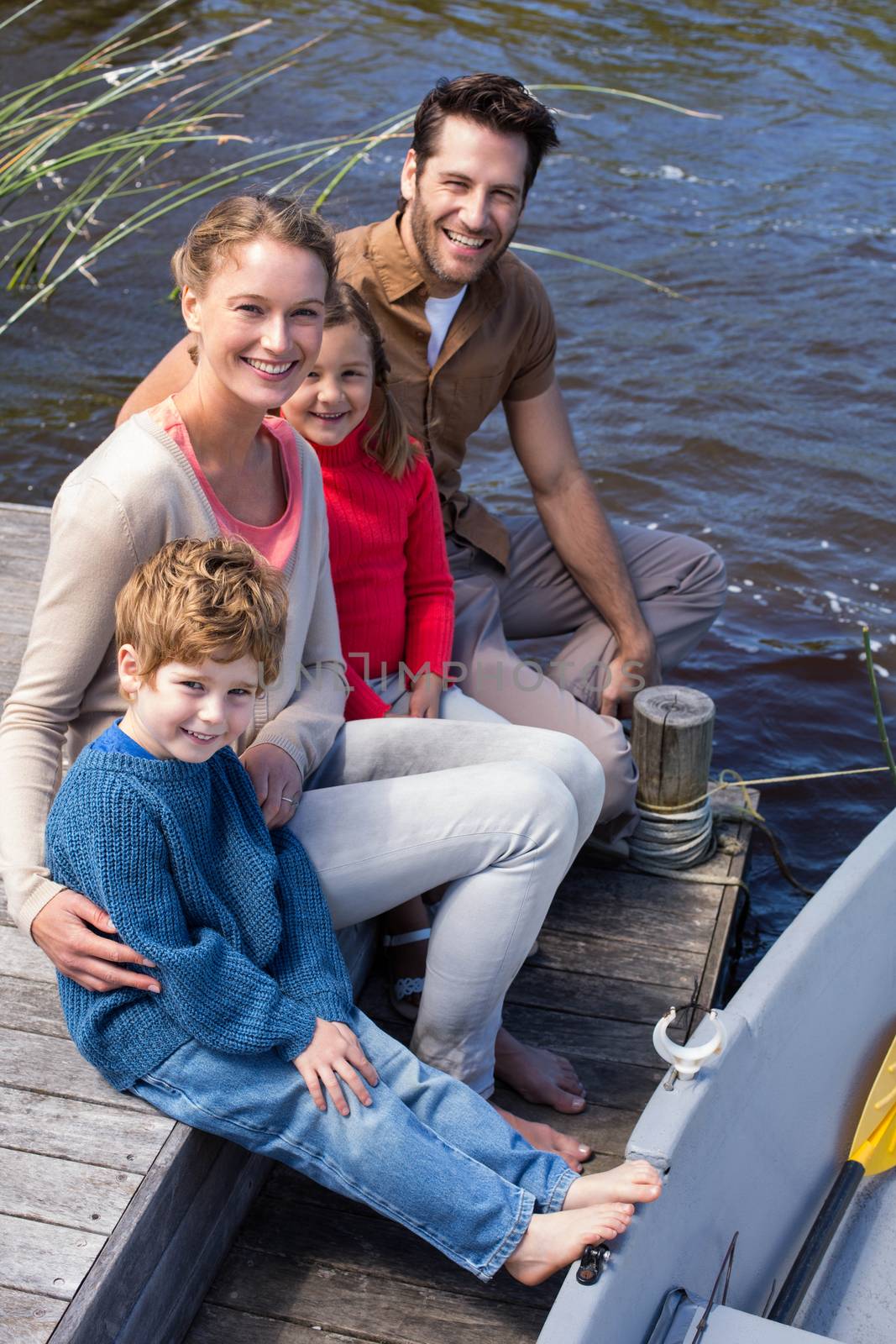 Happy family at a lake in the countryside