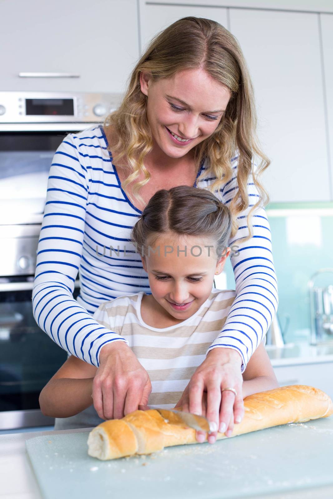 Happy family preparing lunch together by Wavebreakmedia