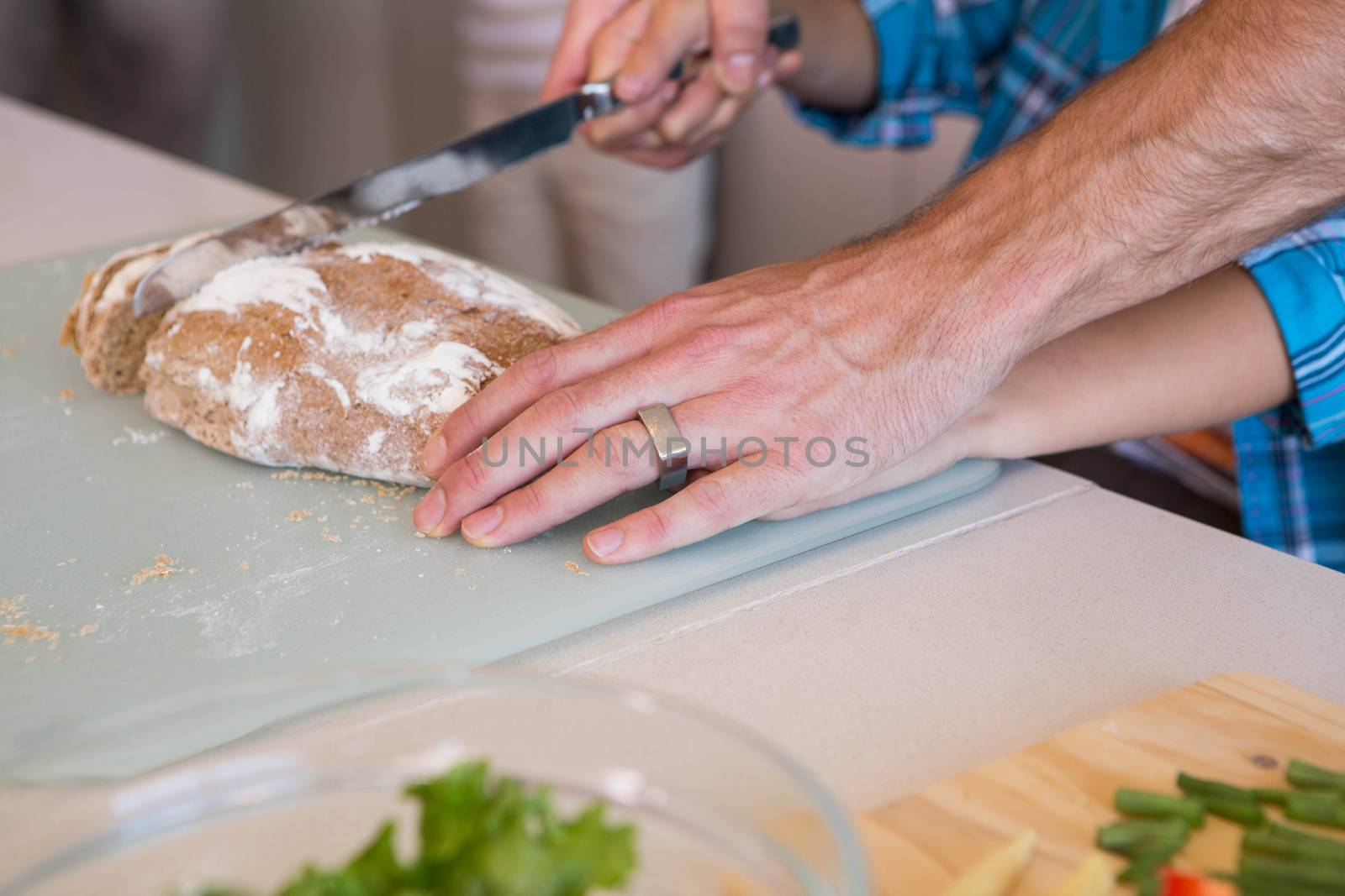 Happy family preparing lunch together at home in the kitchen