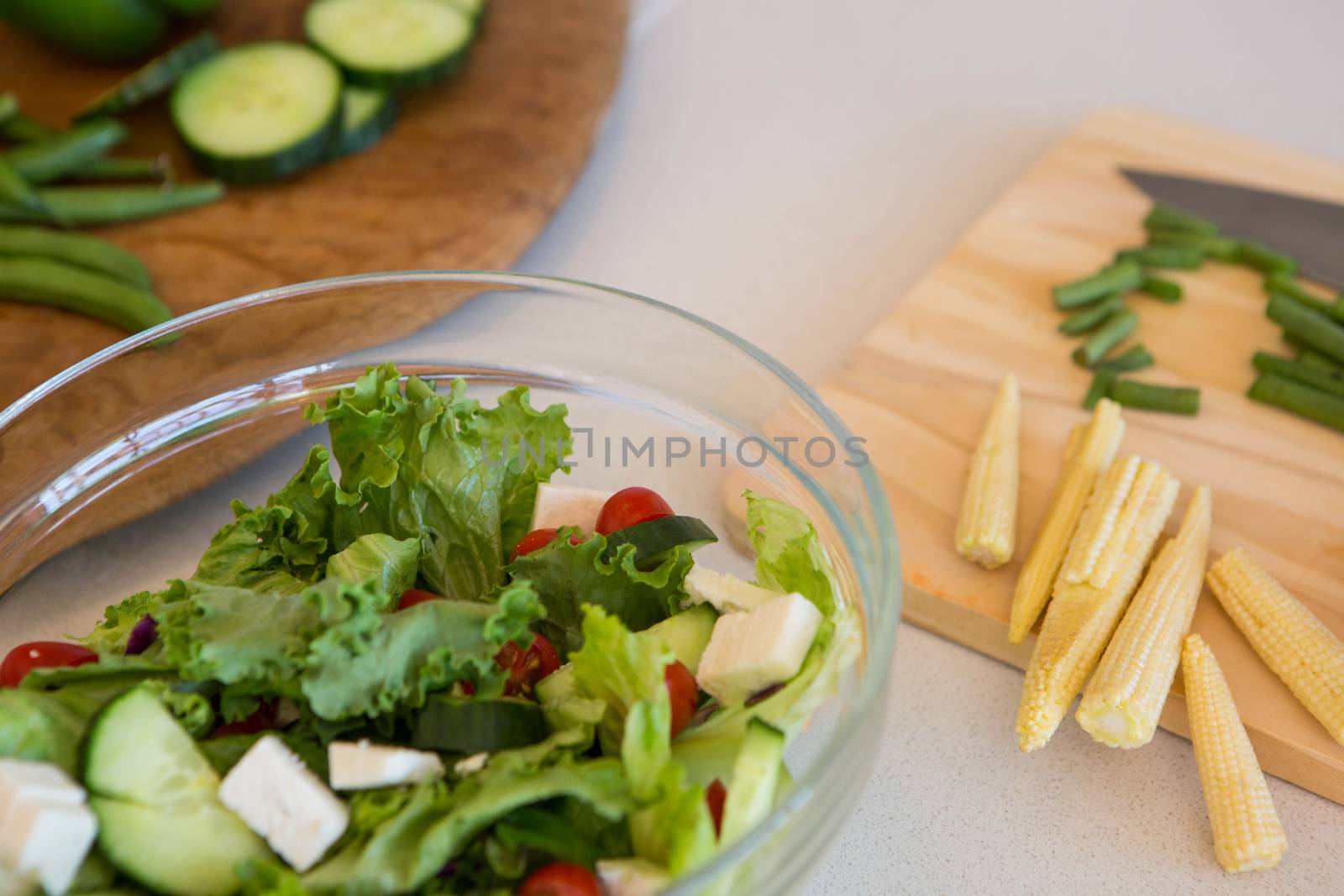 Salad and vegetables on table  by Wavebreakmedia