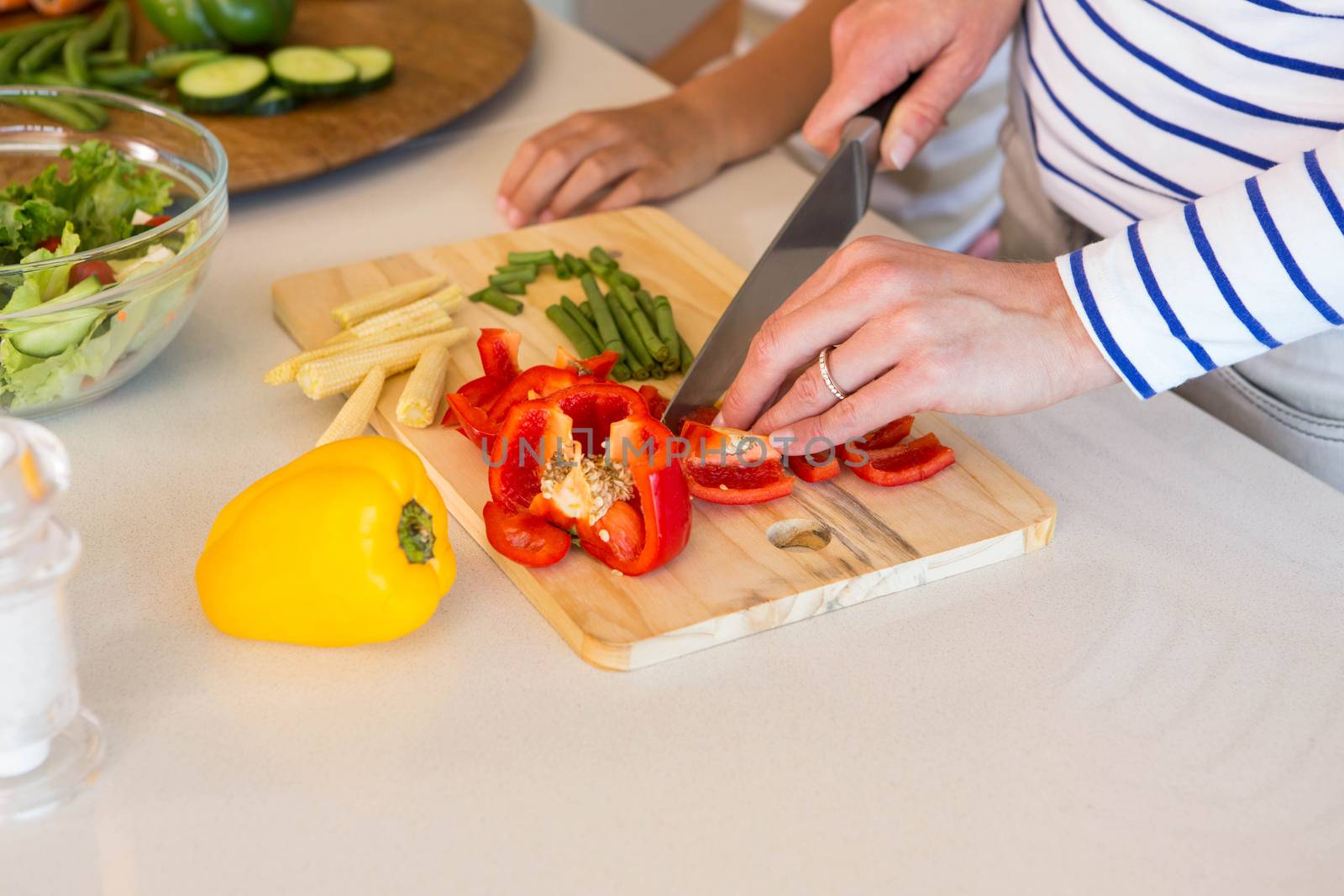 Happy family preparing lunch together by Wavebreakmedia