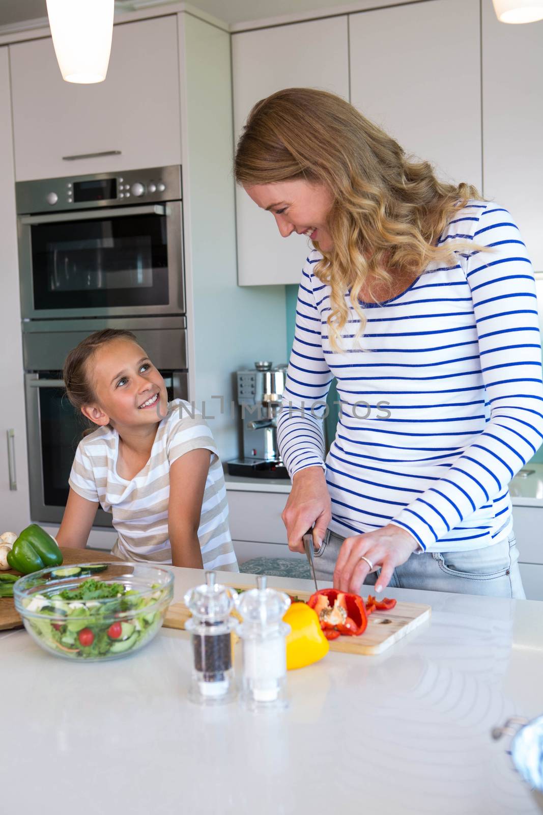 Happy family preparing lunch together at home in the kitchen