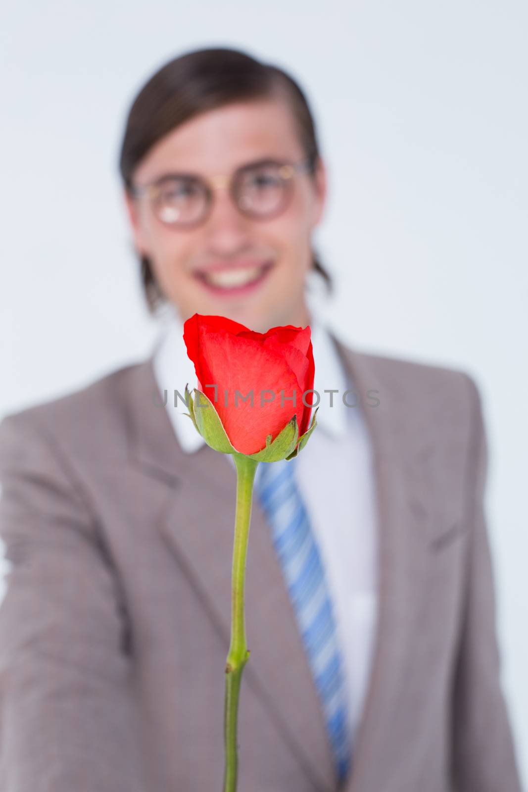Geeky businessman offering a rose by Wavebreakmedia