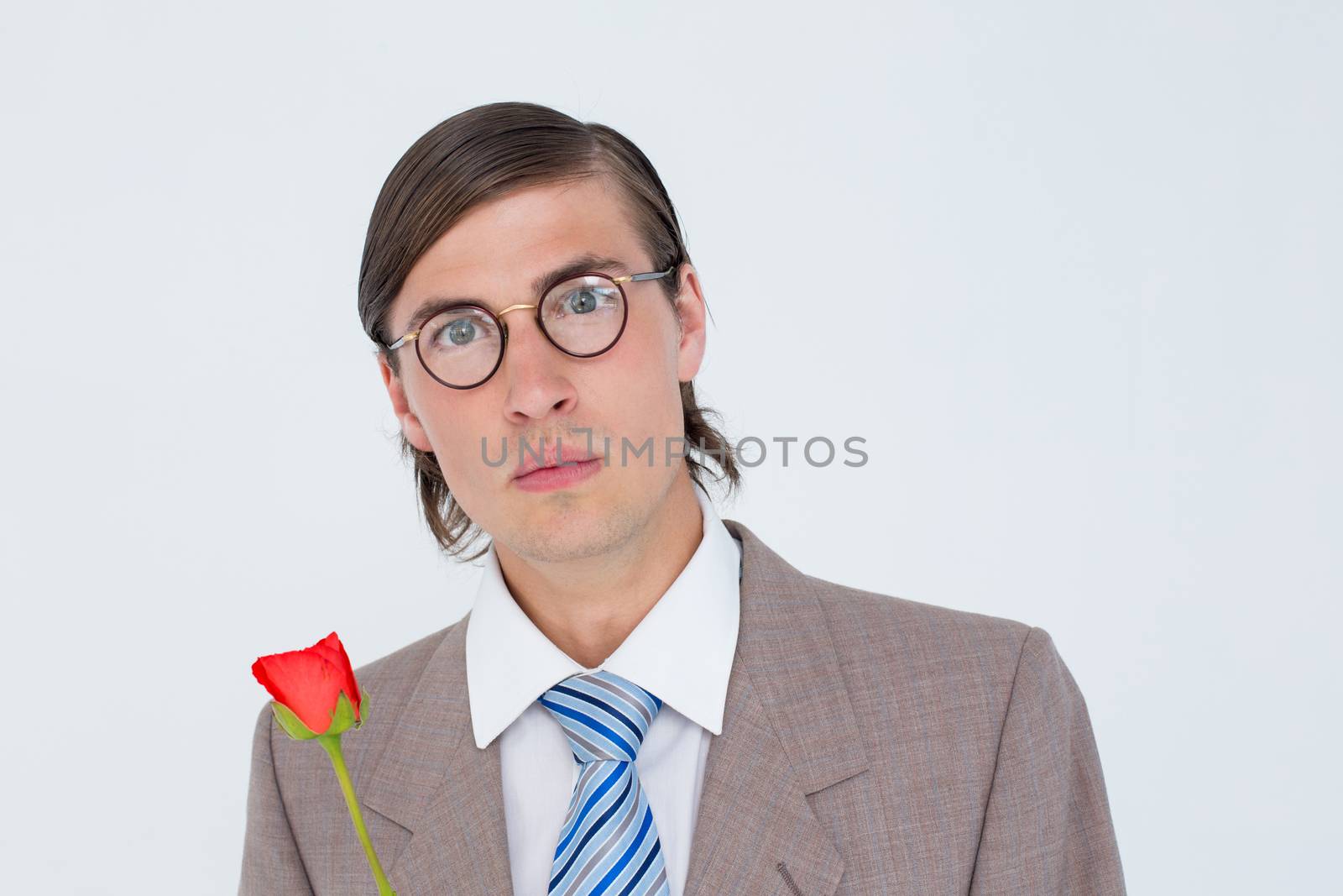 Geeky businessman offering a rose on white background