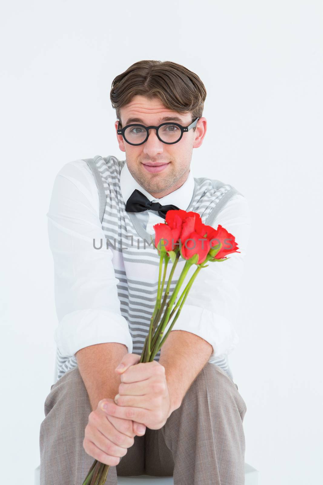 Geeky hipster offering bunch of roses on white background
