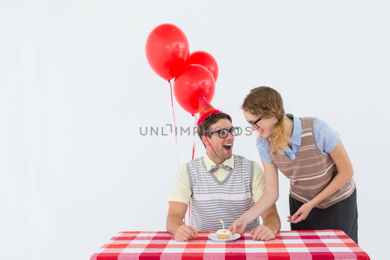 Geeky hipster couple celebrating his birthday on white background