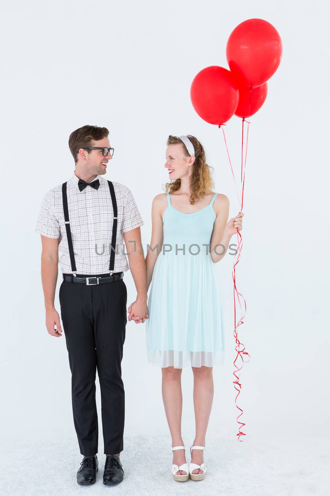 Geeky hipster couple hands in hands on white background