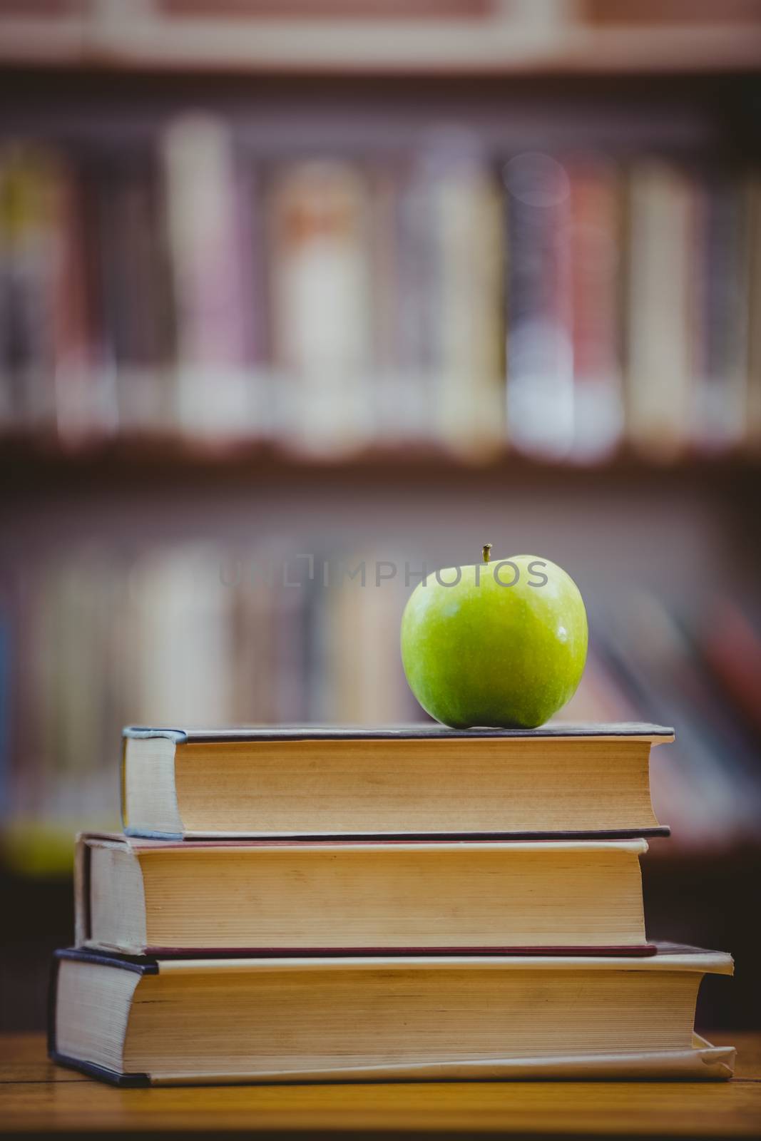 Apple on pile of books at the elementary school