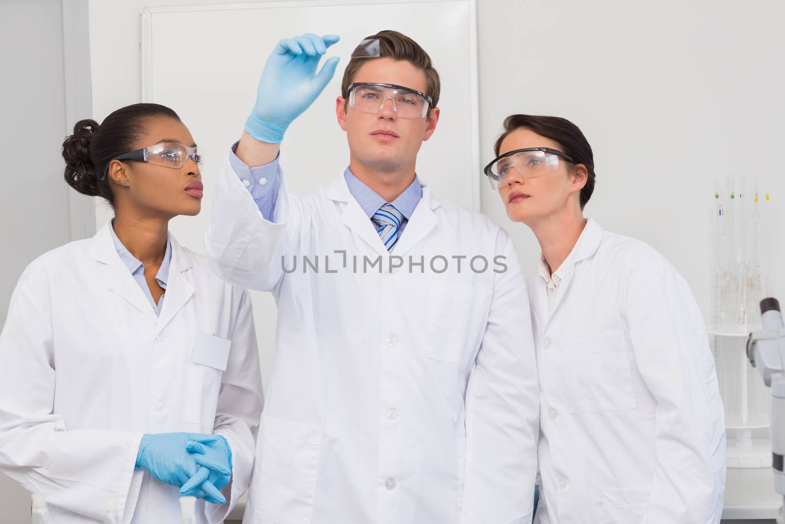 Scientists looking at experimentation in the laboratory 