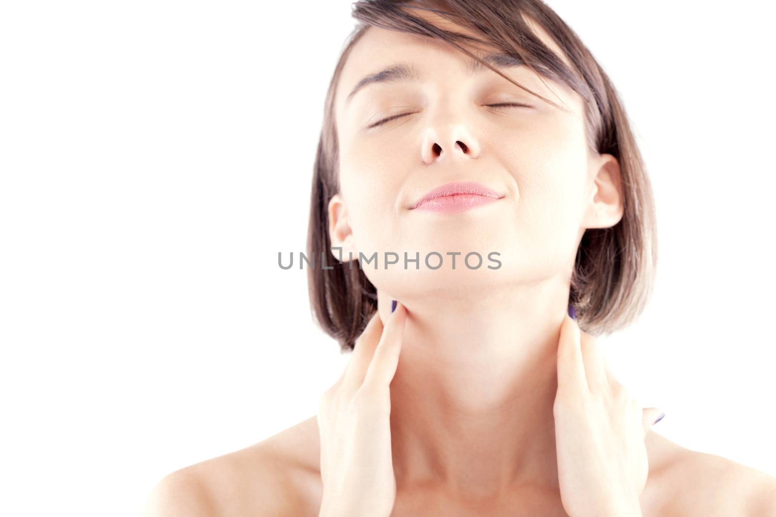 female beauty facial portrait of a Caucasian model enjoying with closed eyes, focus on the lips