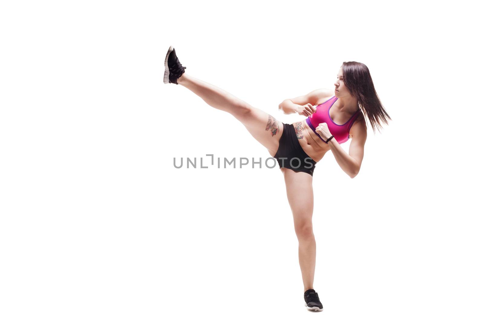 Fitness girl. Sexy athletic woman in a fighting pose