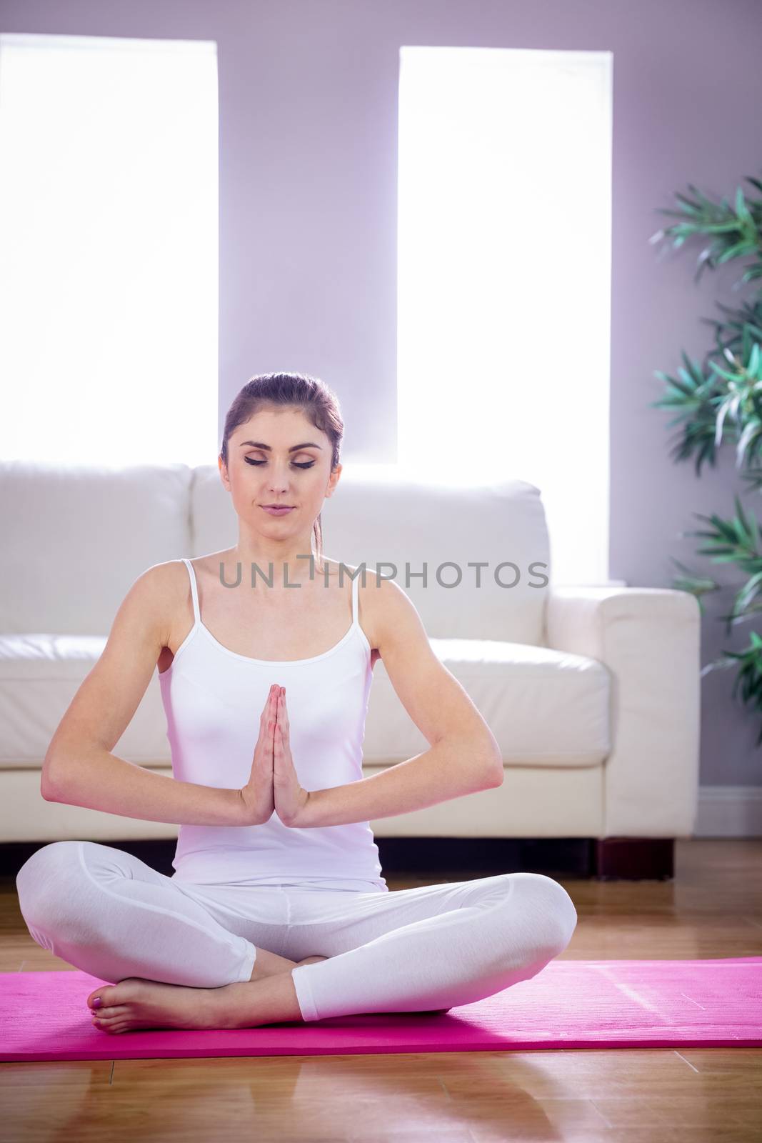 Fit woman doing yoga on mat by Wavebreakmedia