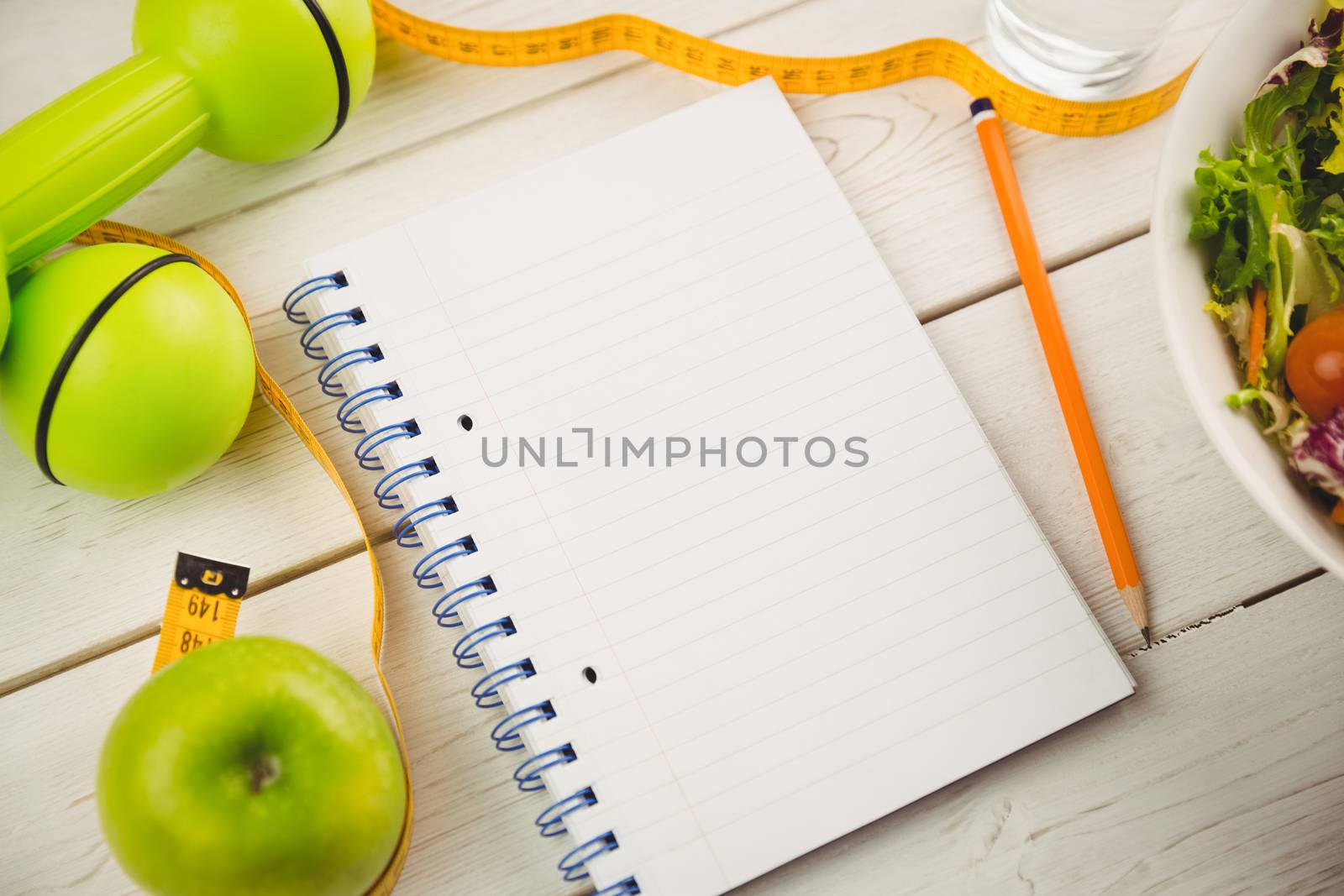 Notepad with indicators of healthy lifestyle by Wavebreakmedia