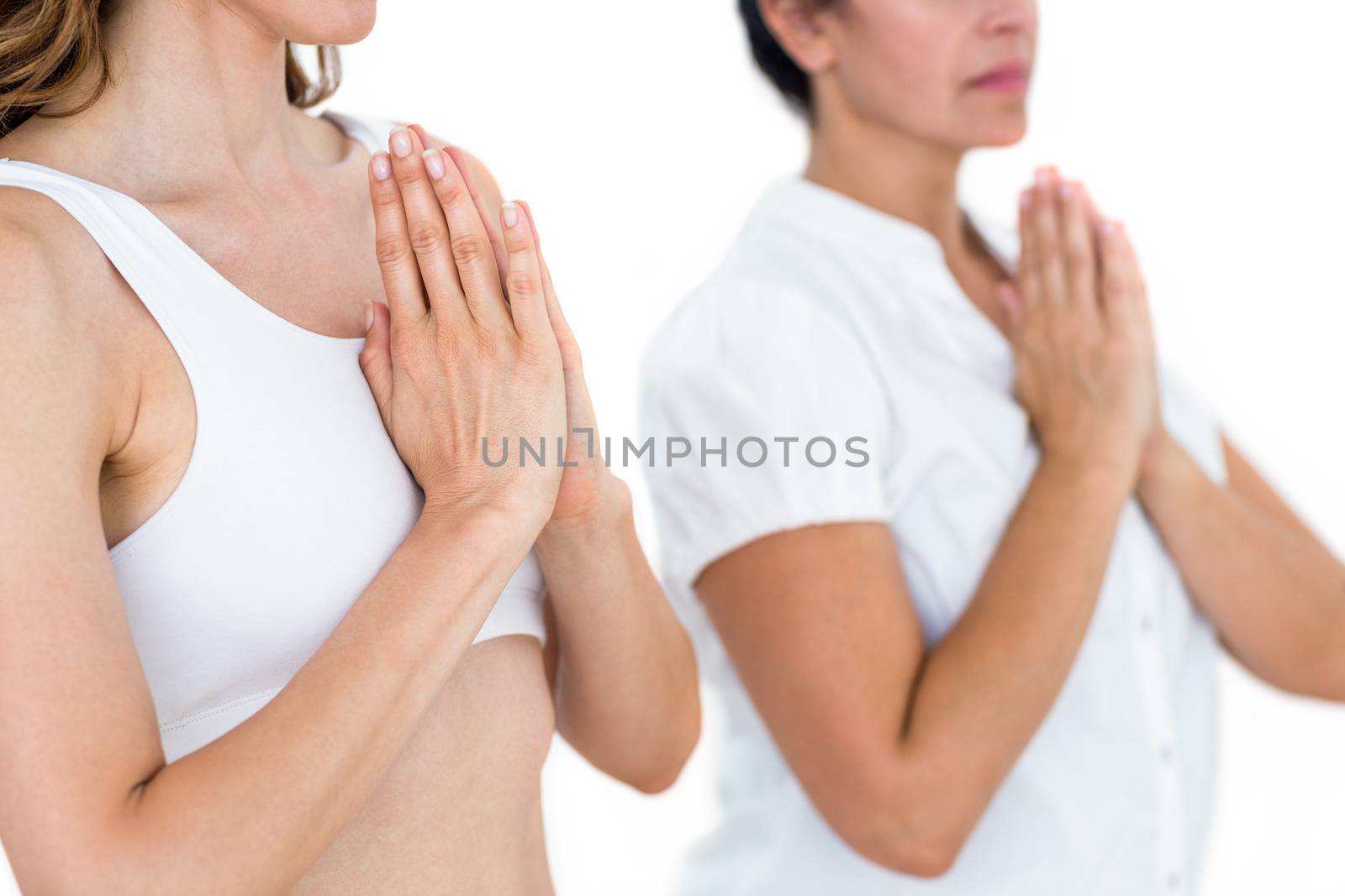 Relaxed women doing yoga on white background