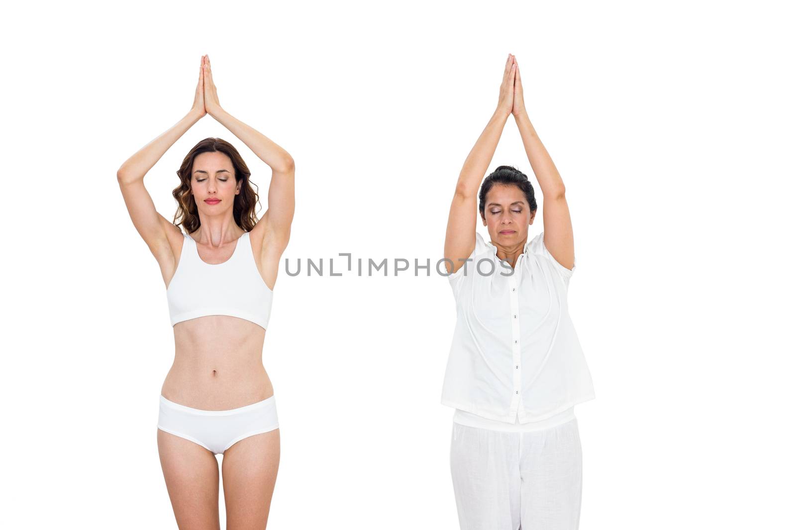 Relaxed women raising arms on white background