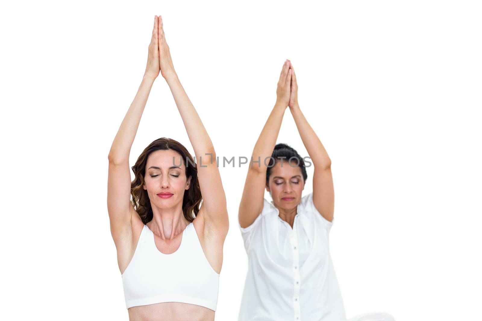 Relaxed women raising arms on white background