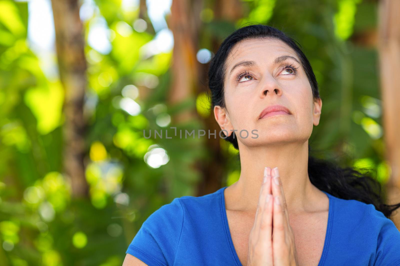 Relaxed woman doing yoga on a sunny day