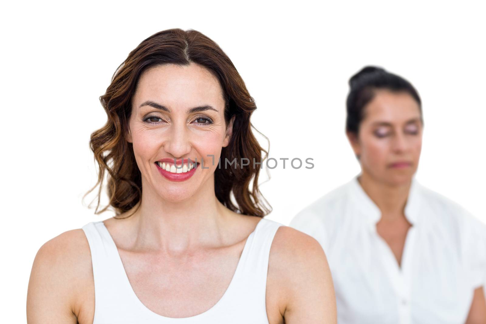 Women sitting in lotus pose on white background