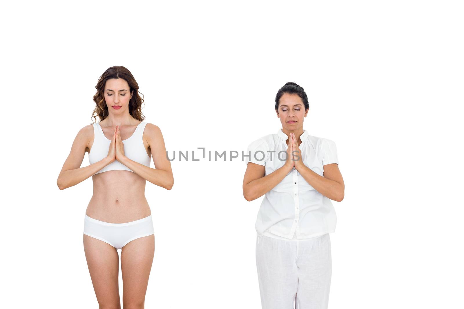 Relaxed women doing yoga on white background