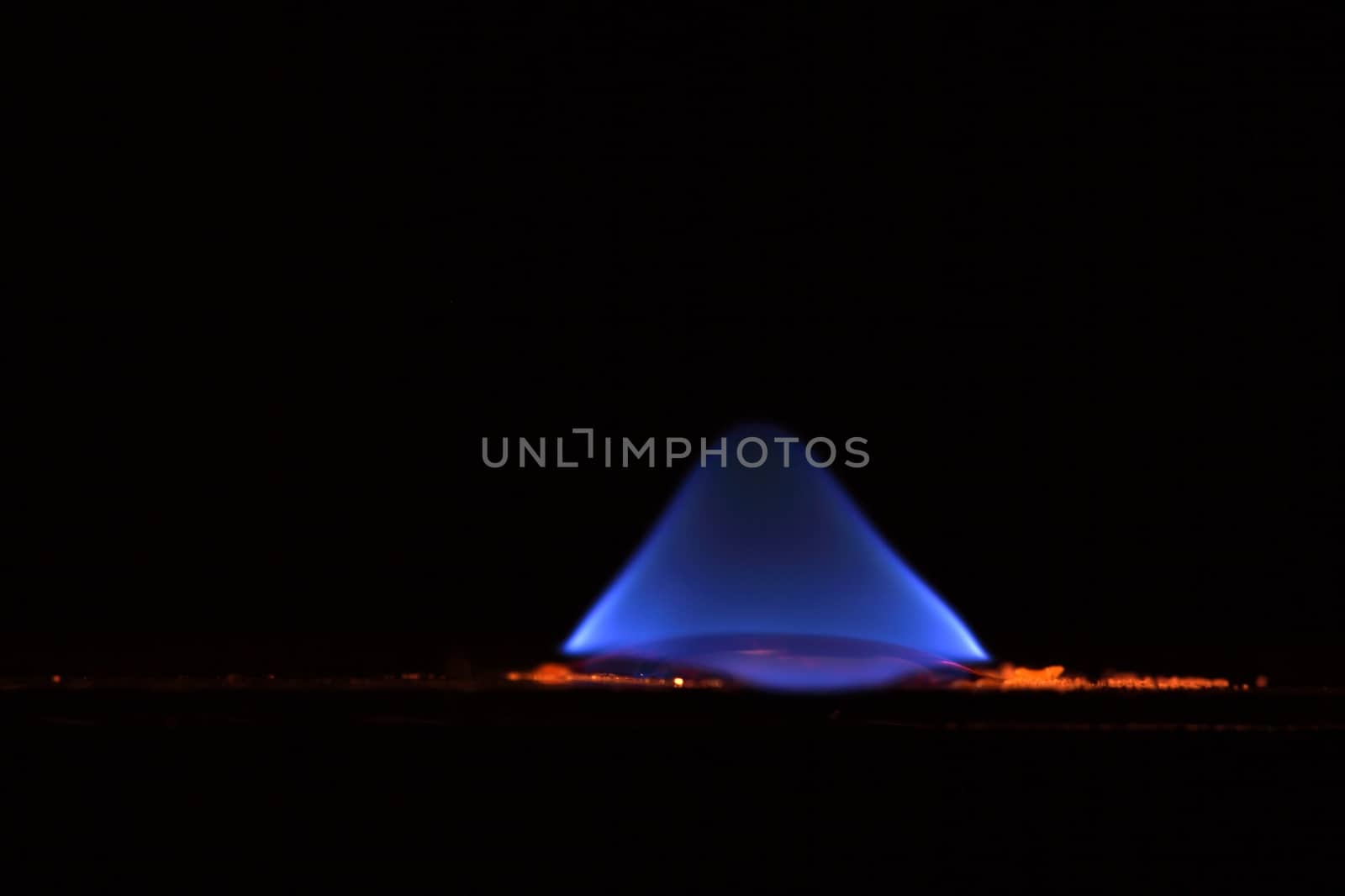 A macro photography of burning sulfur powder.