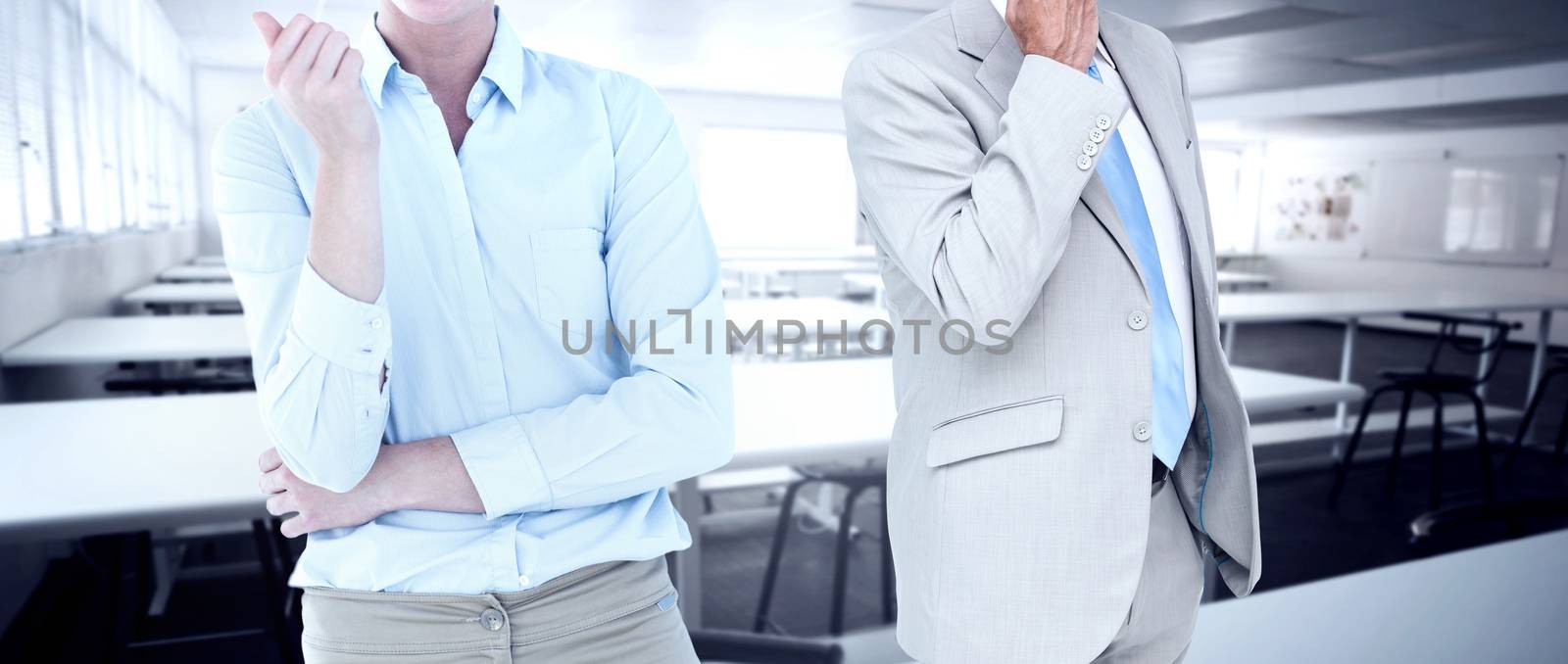 Smiling businesswoman looking at camera against empty class room 