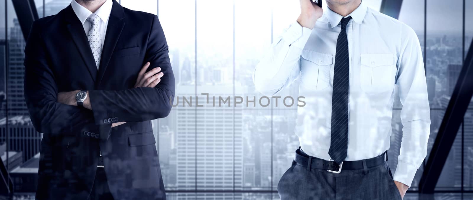 Businessman on the phone against room with large window looking on city