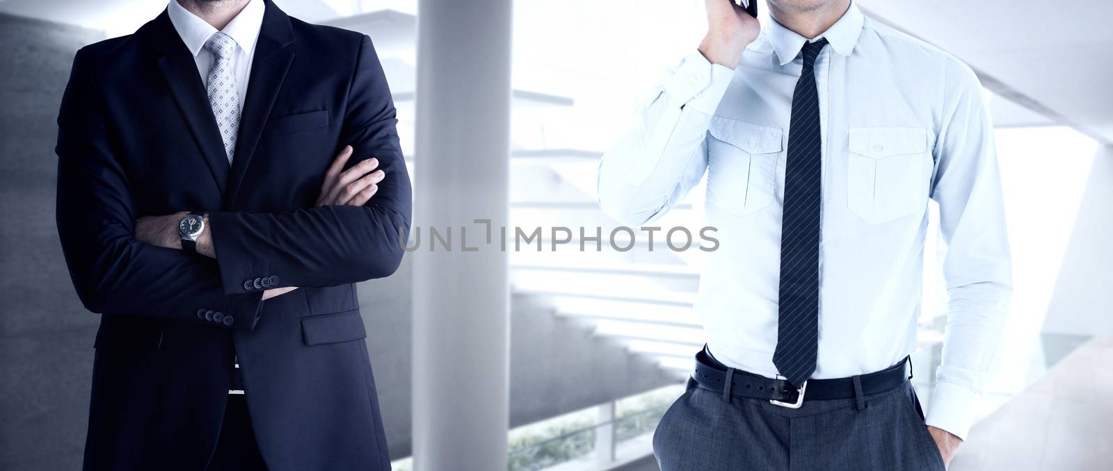 Businessman on the phone against stylish modern home interior with staircase