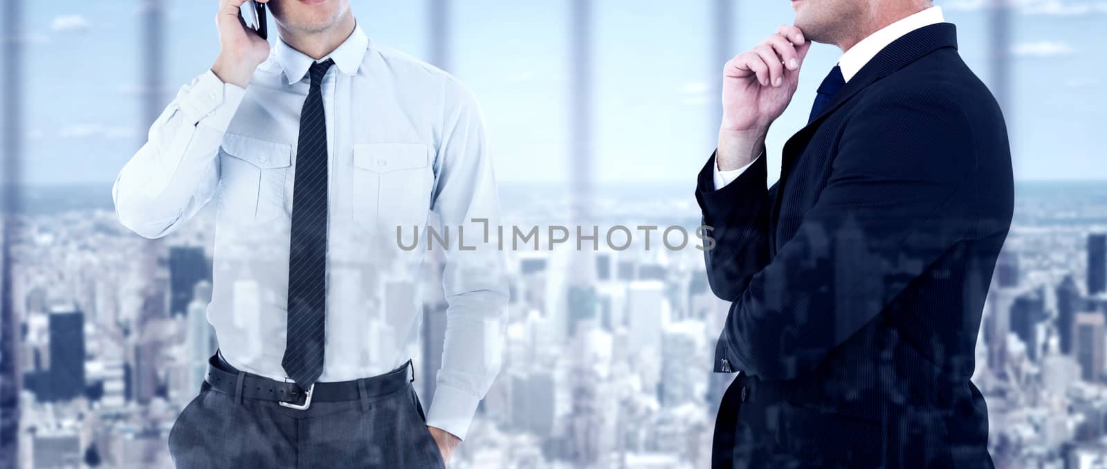 Composite image of elegant businessman in suit posing  by Wavebreakmedia