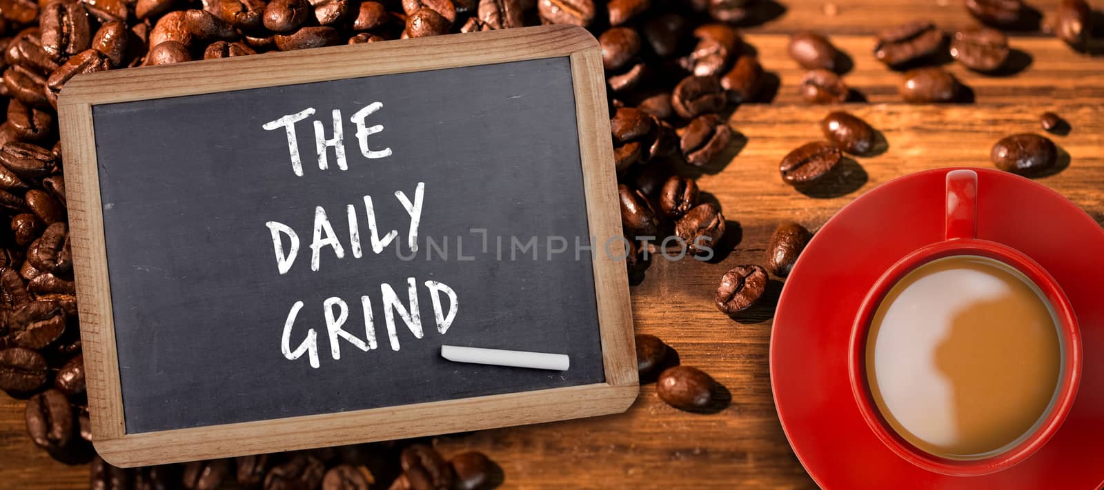 Red cup of coffee against chalkboard with piece of chalk