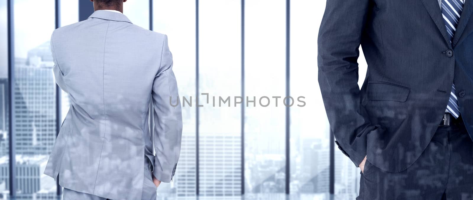 Thinking businessman against room with large window looking on city