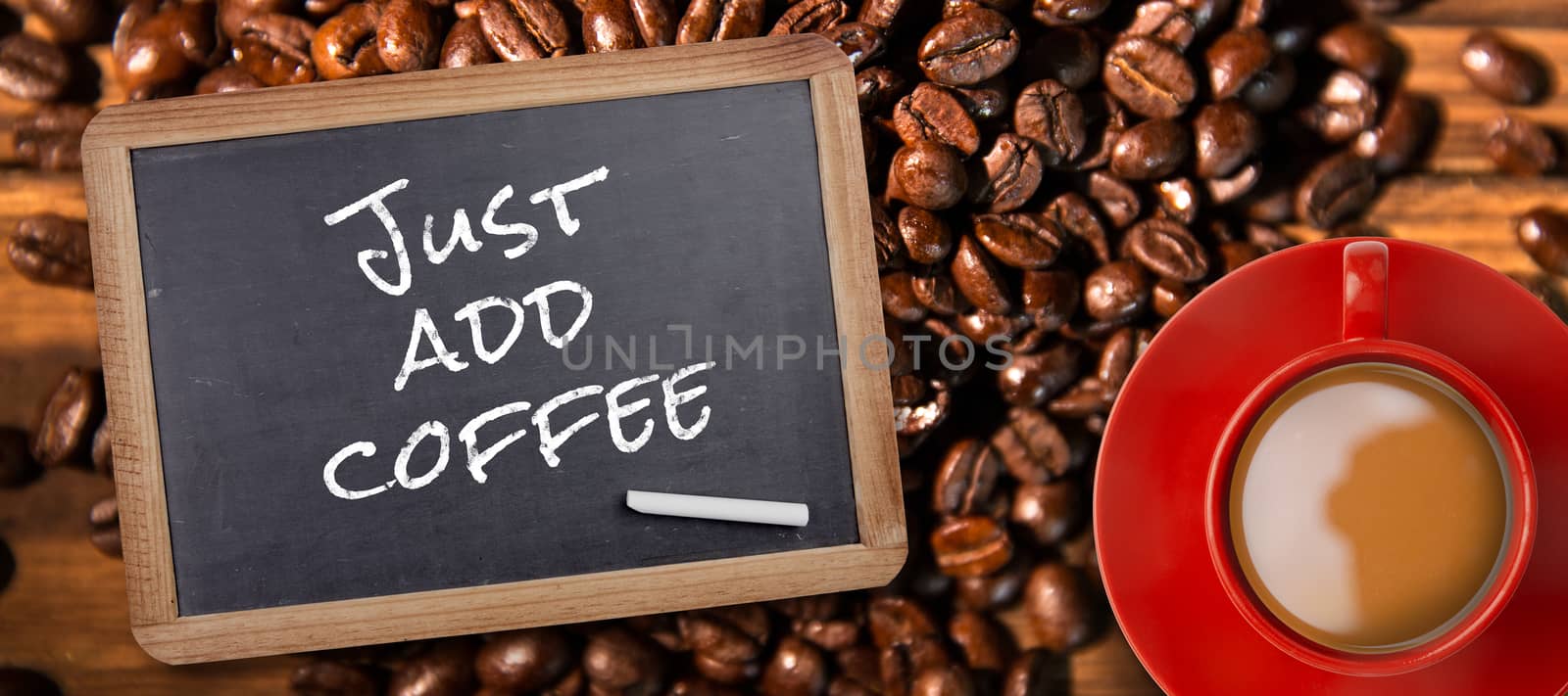 Red cup of coffee against chalkboard with piece of chalk