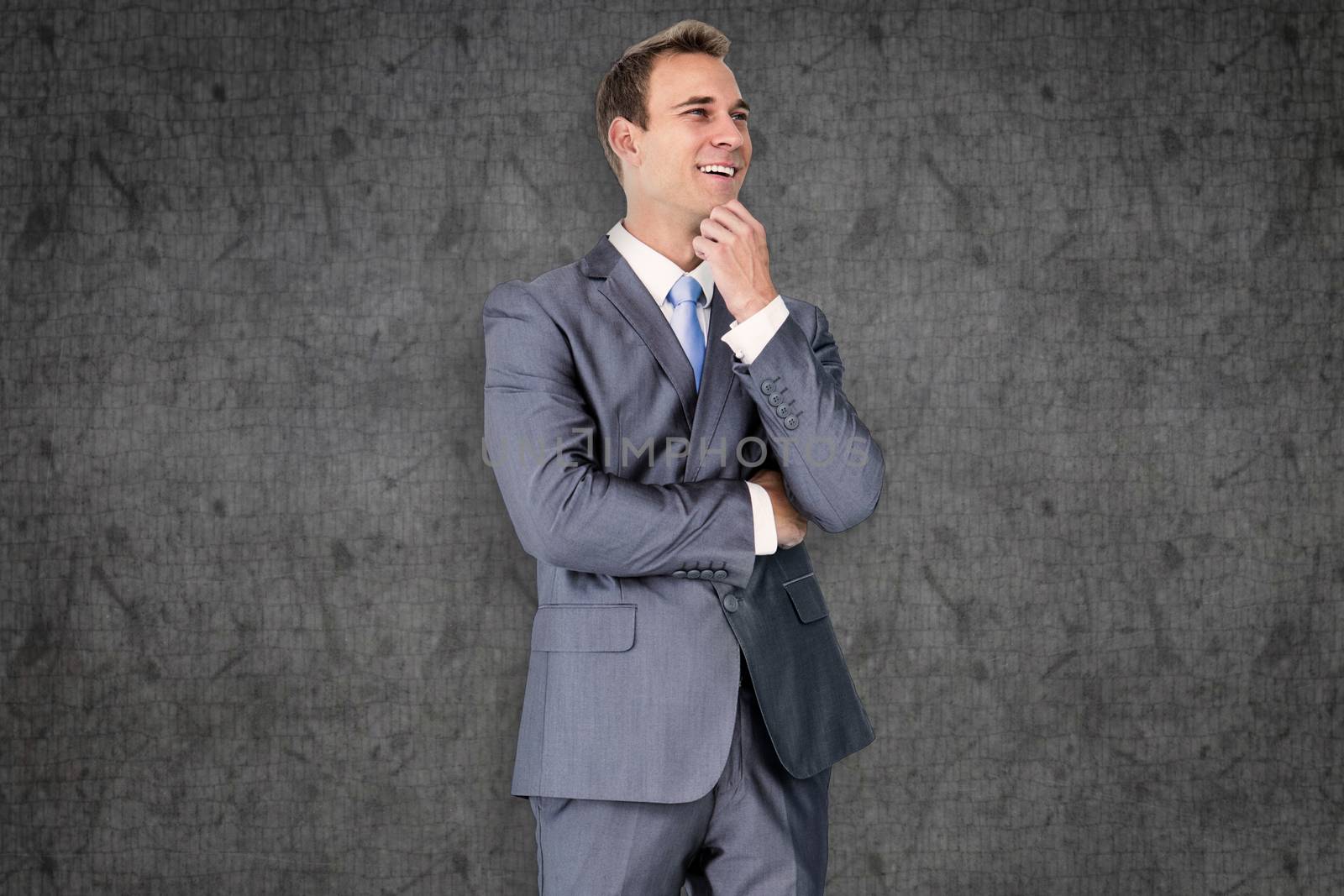 Thinking businessman against grey background