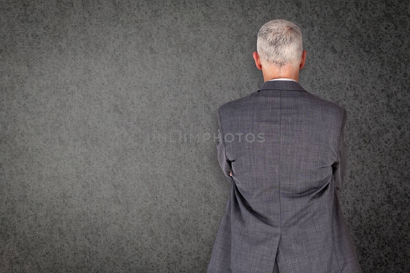 Composite image of businessman standing by Wavebreakmedia