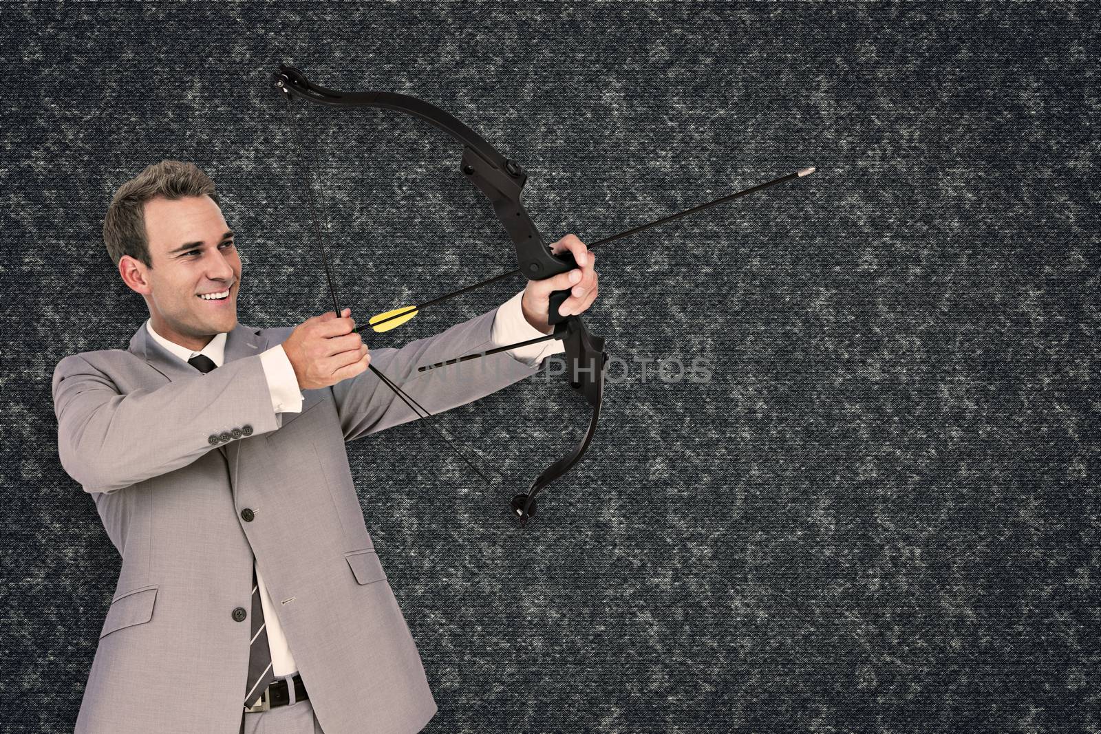 Composite image of businessman shooting arrow by Wavebreakmedia