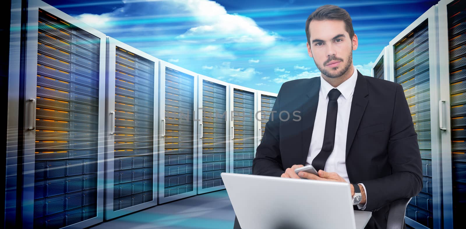 Cheerful businessman with laptop using smartphone against composite image of server towers