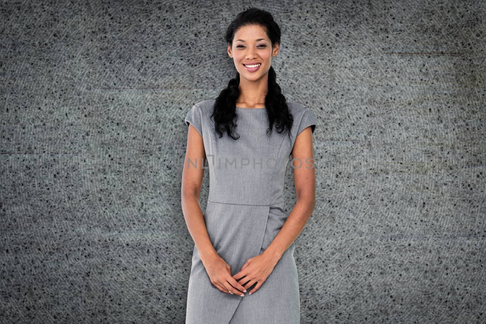 Composite image of businesswoman smiling by Wavebreakmedia