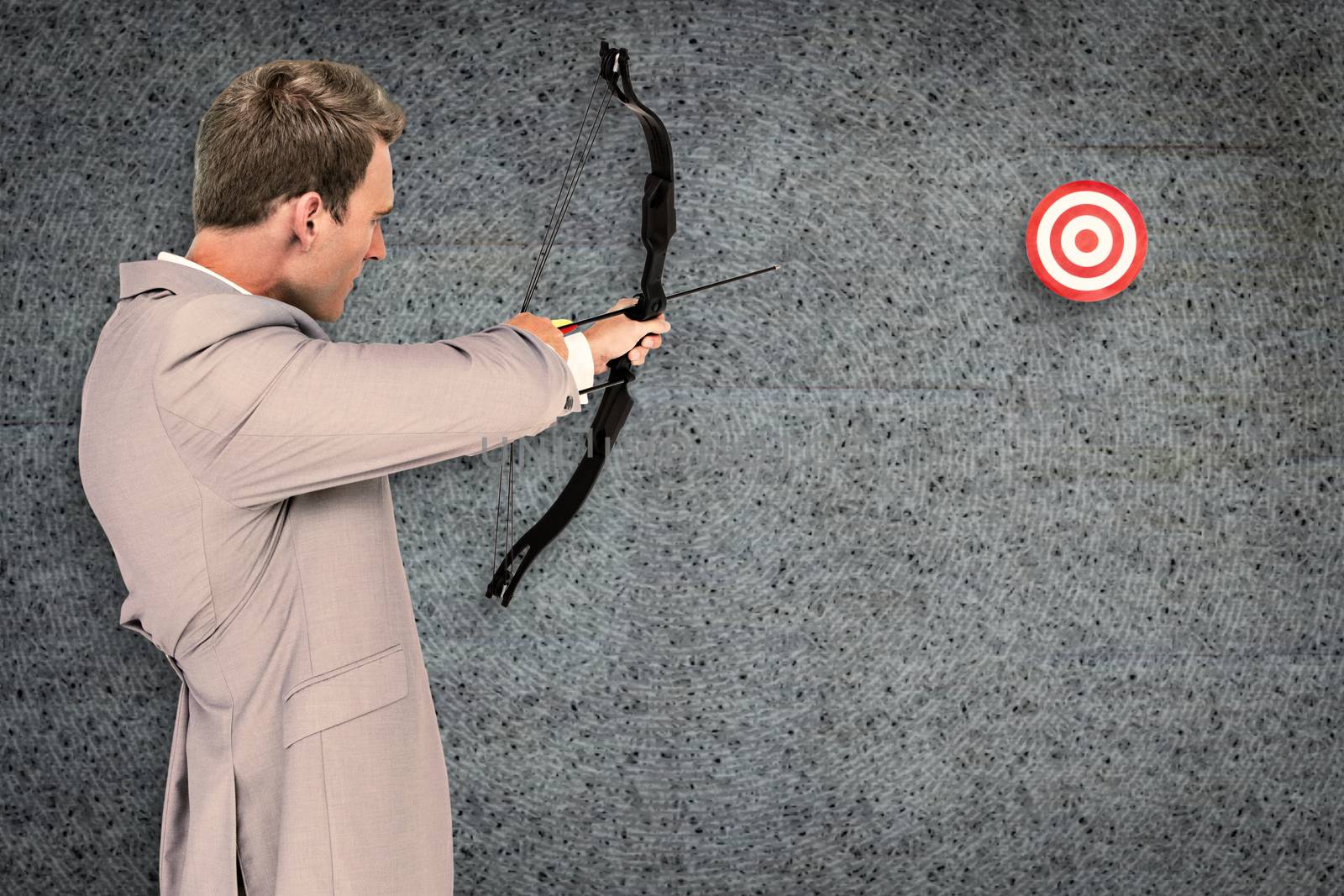 Composite image of businessman shooting target by Wavebreakmedia