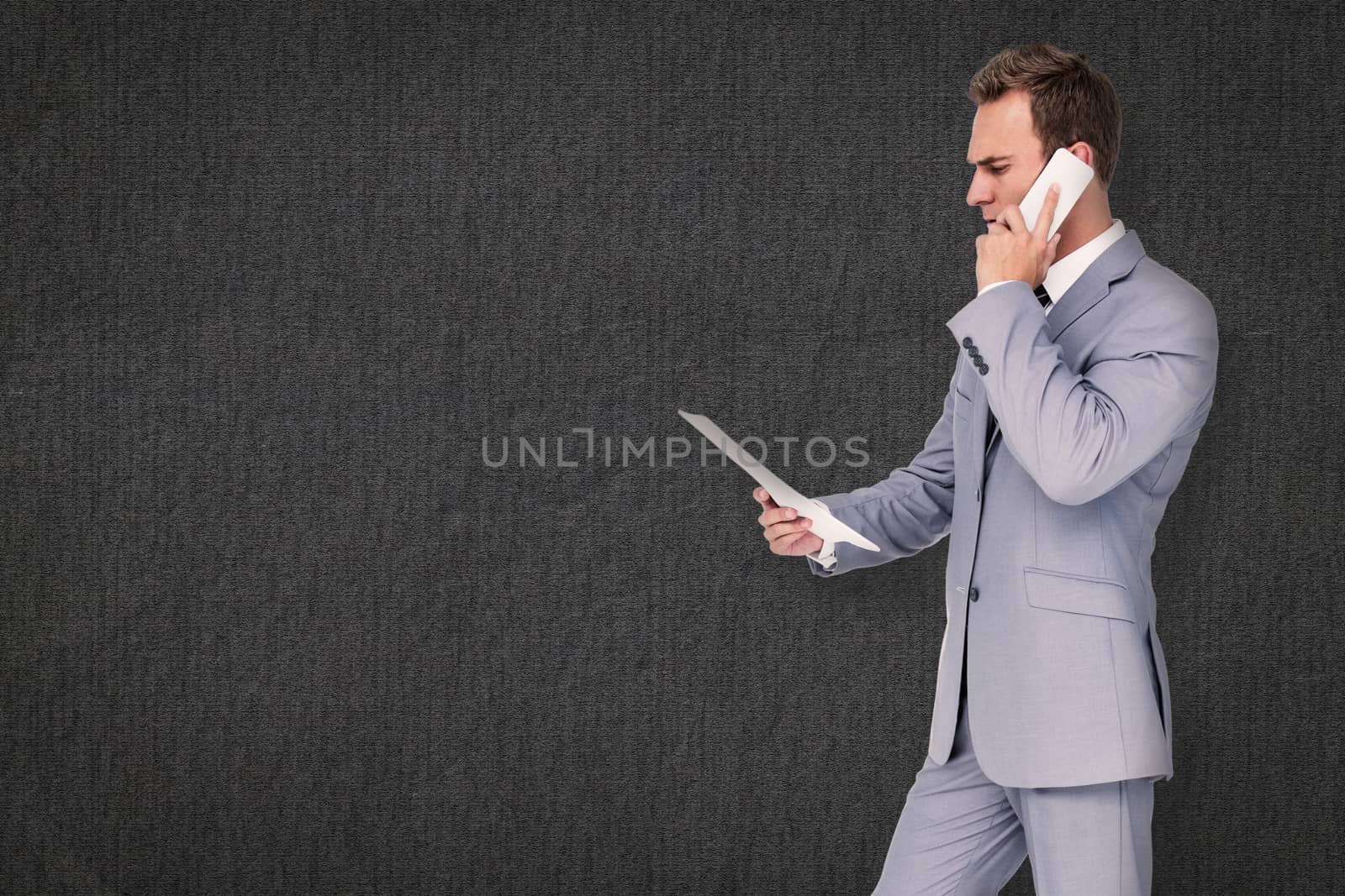 Composite image of businessman on the phone by Wavebreakmedia