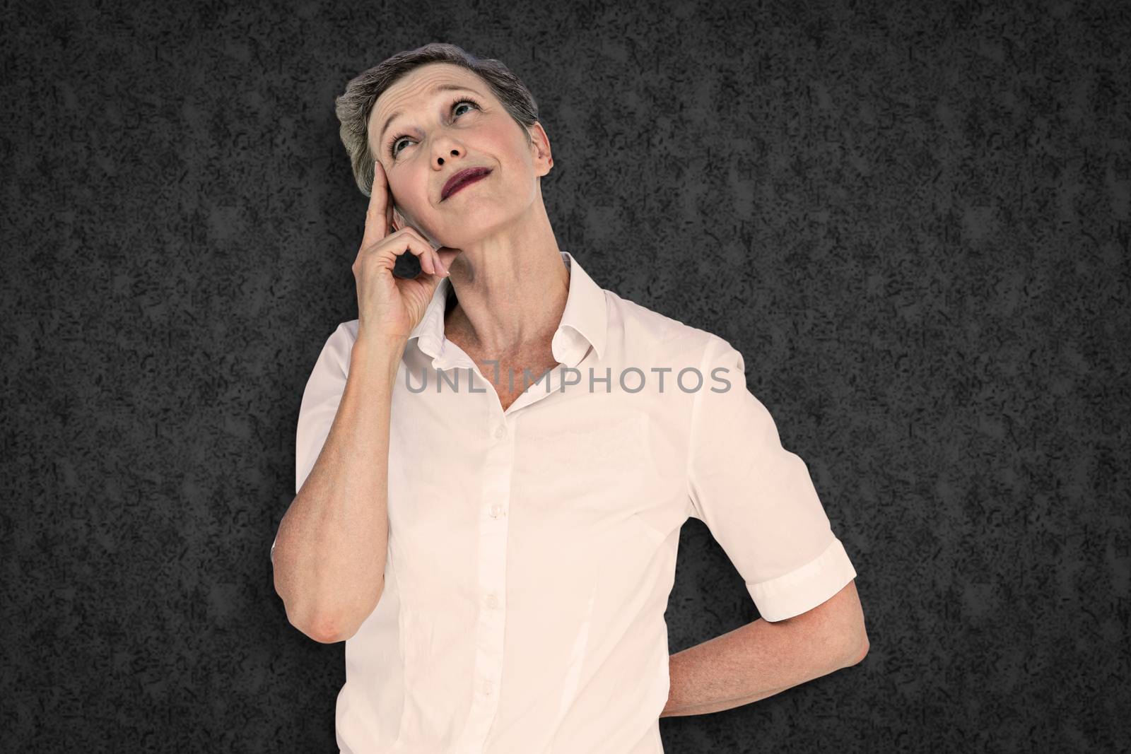 Composite image of businesswoman thinking by Wavebreakmedia