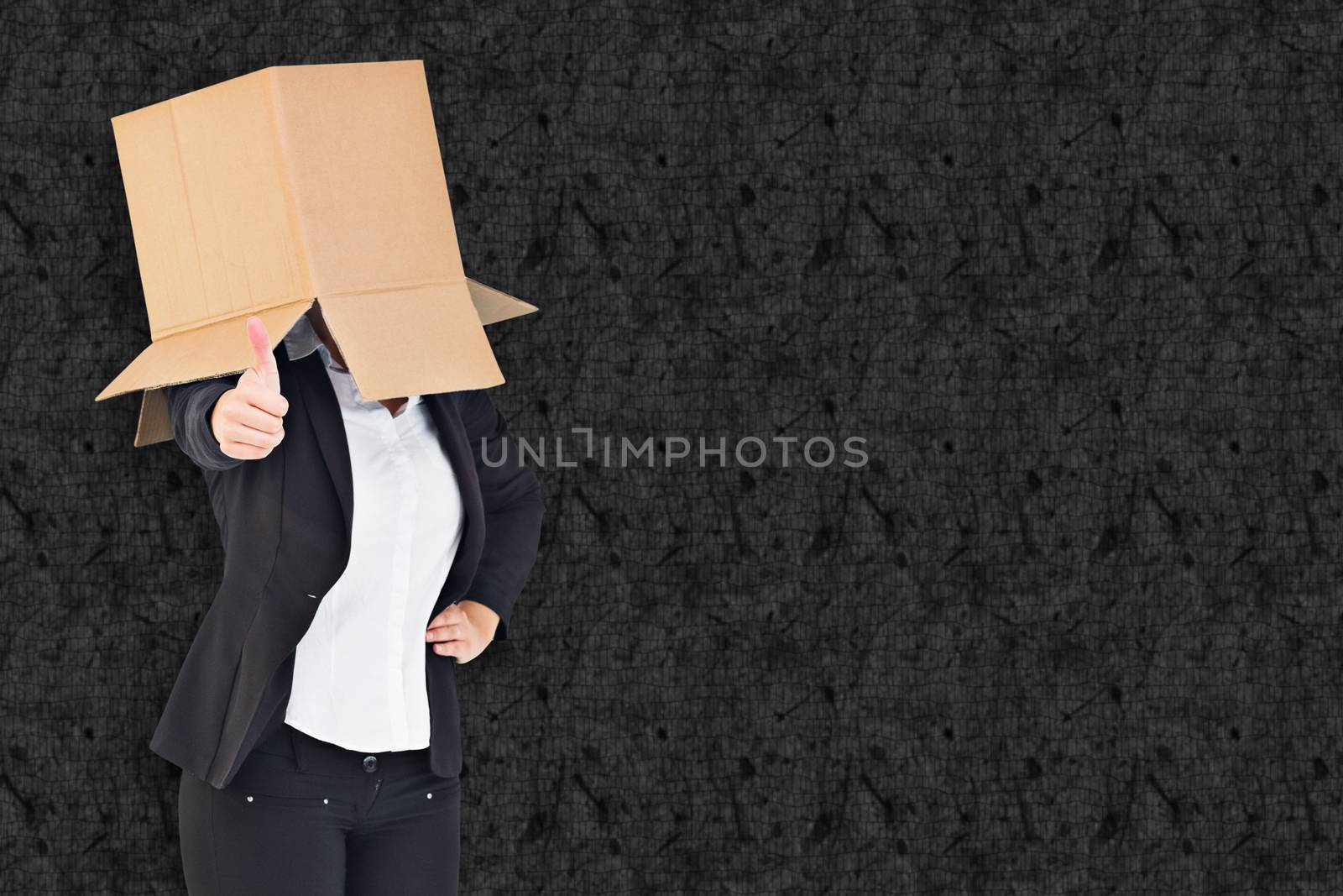 Composite image of businesswoman showing thumbs up with box over head by Wavebreakmedia