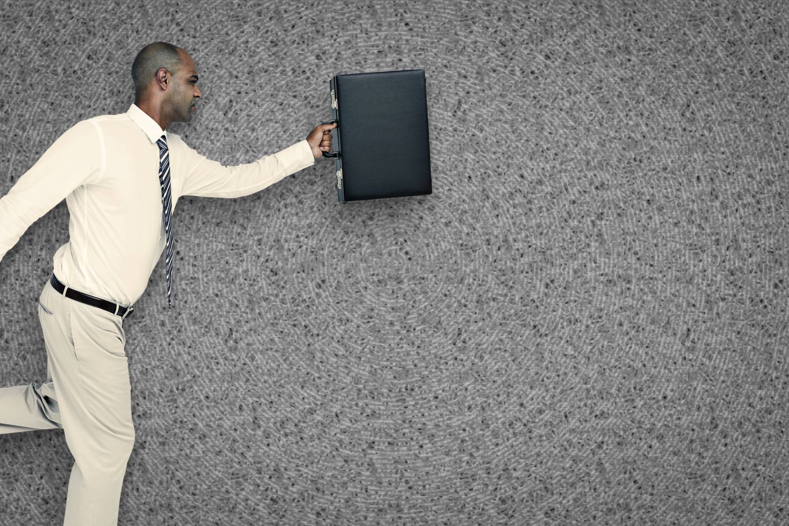 Composite image of businessman running with briefcase by Wavebreakmedia