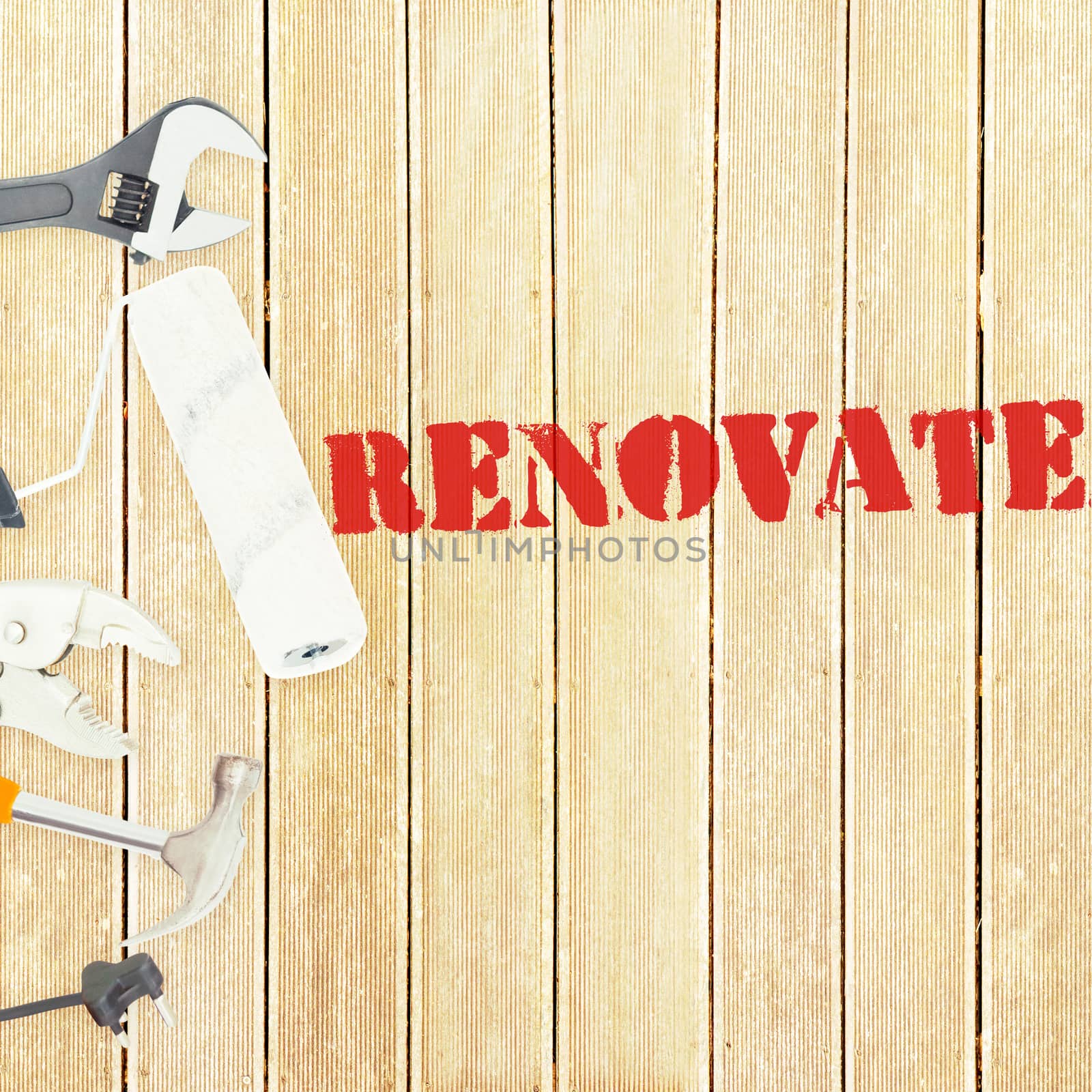 The word renovate  against tools on wooden background