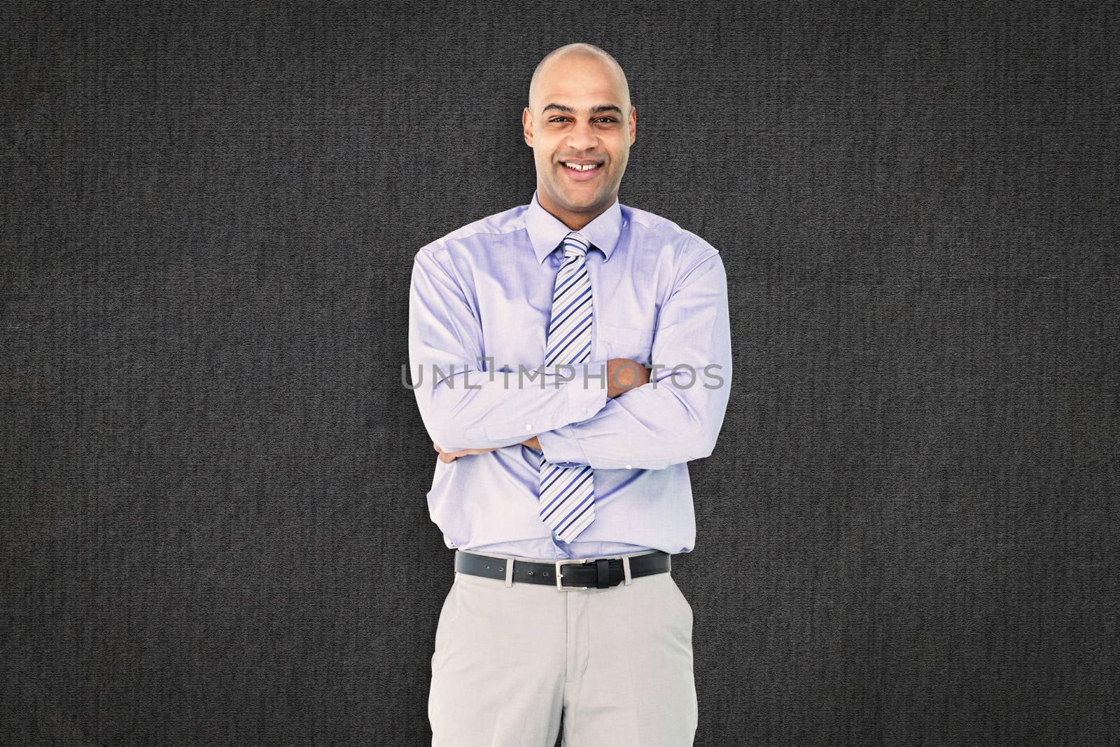 Happy businessman against grey background