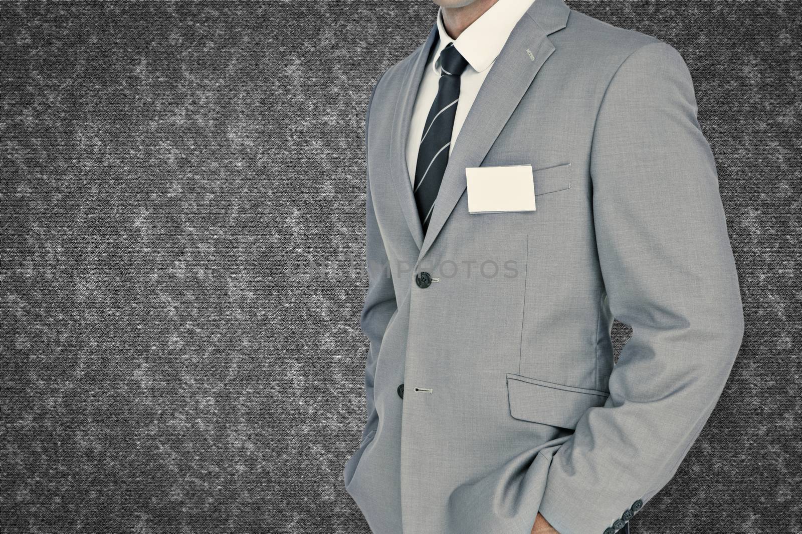 Composite image of businessman with badge by Wavebreakmedia