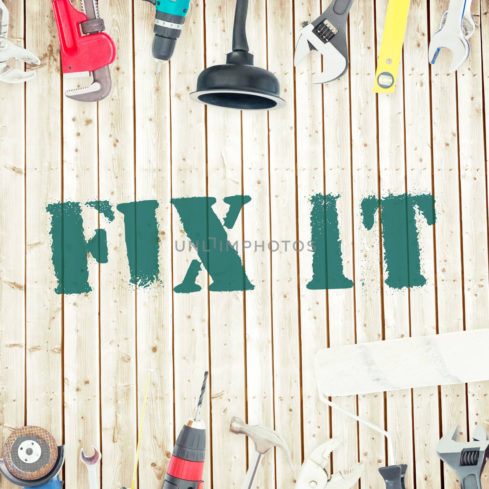 The word fix it against tools on wooden background