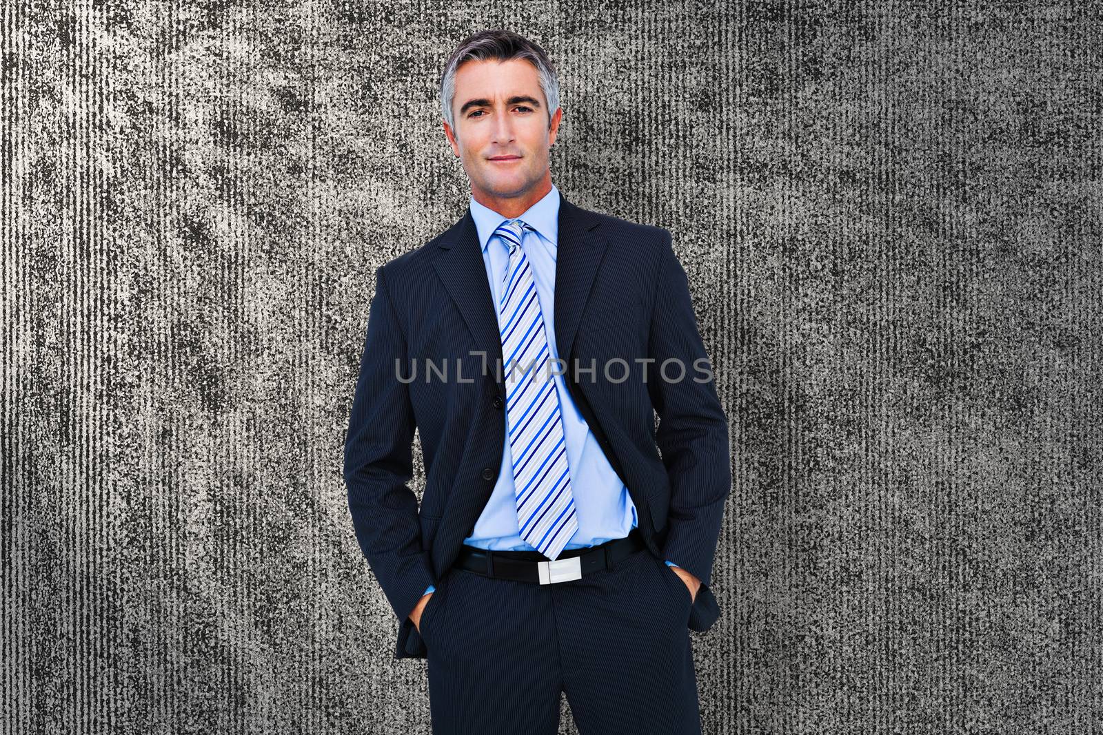 Businessman against grey background