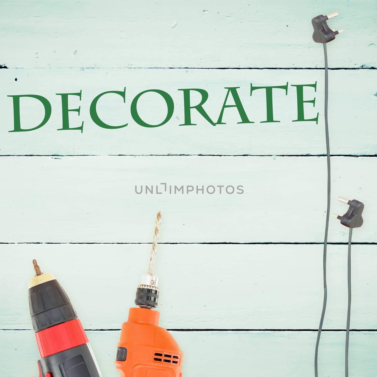 Decorate  against tools on wooden background by Wavebreakmedia