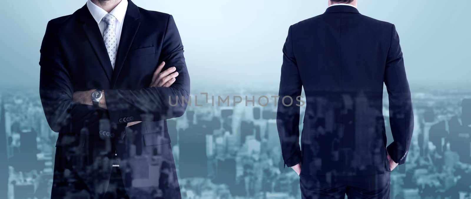 Rear view of handsome businessman  against high angle view of city